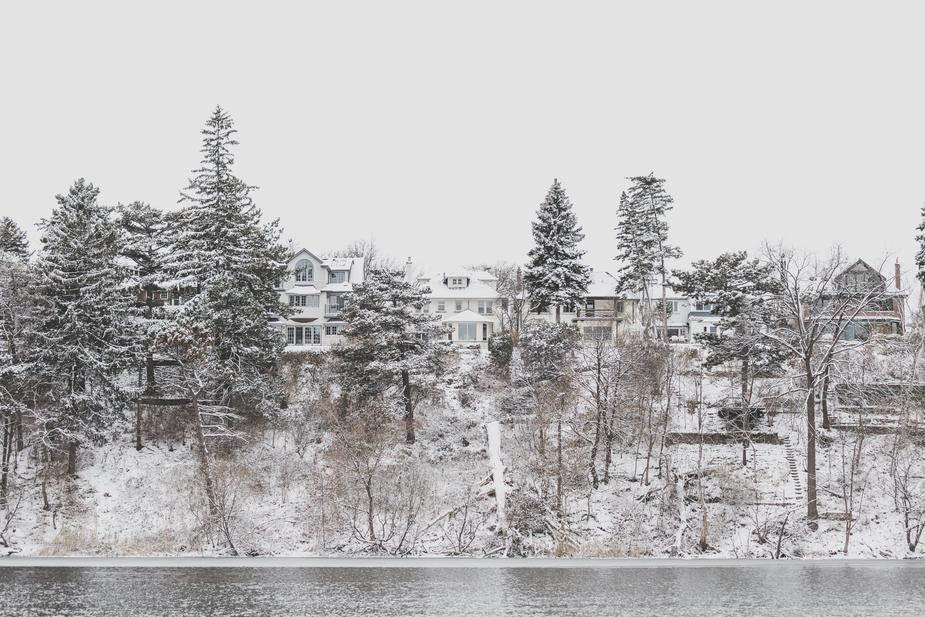 Lake Front House Covered with Snow